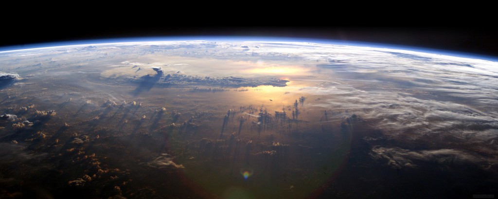An image of the Earth from space showing the Earth's wafer-thin atmosphere looking like a blue rim 