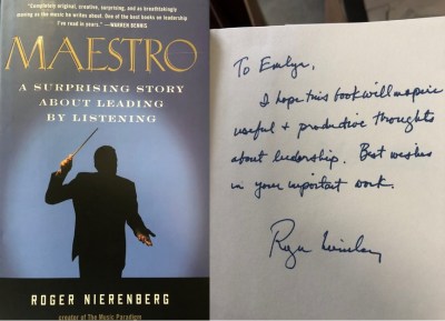 Book cover of "Maestro" by Roger Nierenberg, showing an orchestra conductor, next to a handwritten note to Emlyn Koster from the author